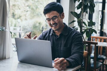 asian man work using computer hand typing laptop keyboard contact us.student study learning education online.adult professional people chatting search at office.concept for technology device business