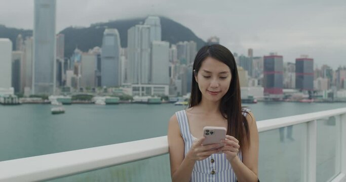 Woman use of mobile phone in Hong Kong city