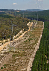 Fototapeta na wymiar powerlines cut across the Victorian countryside towards the Loy Yang Power Station.