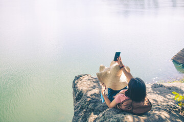 Female tourists in beautiful nature in tranquil scene safe journey social distancing.