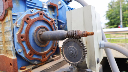 Worm Gear Closeup. The gear reducer of the motor slows down the cycle through the gear and worm. close focus on the subject