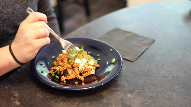 Woman eating eggplant