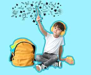Cute little schoolboy listening to music on color background