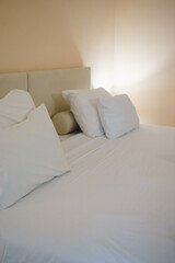 big white bed with pillows