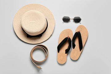 Set of female accessories with stylish sunglasses on grey background