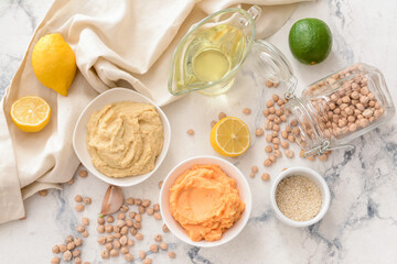 Composition with tasty hummus on light background