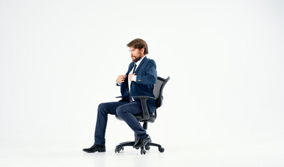 emotional business man in office chair work light background