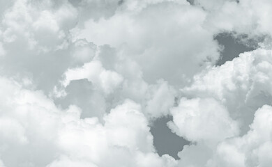 Grey and white fluffy clouds texture. Closeup detail of white clouds texture background. Soft-touch feeling like cotton. White puffy clouds. Gloomy and moody sky. Background for dead and tranquility.