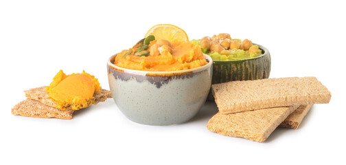 Bowls with tasty hummus and crackers on white background