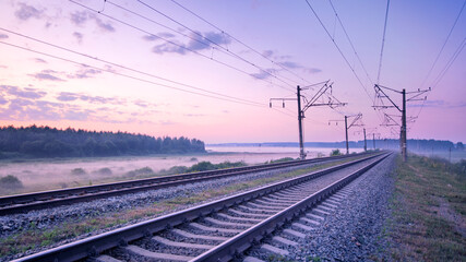 Fototapeta na wymiar Fast traffic on rail flights. Towards sunset.