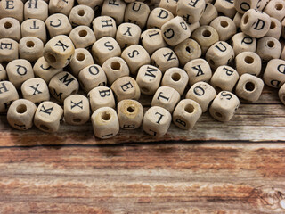 alphabets on wood cube for education or communications  concept