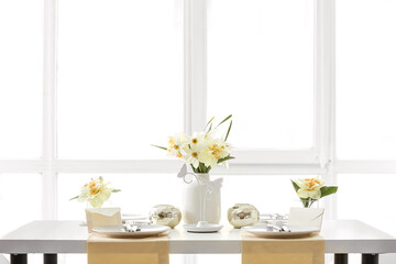 Fototapeta na wymiar Beautiful table setting with narcissus flowers