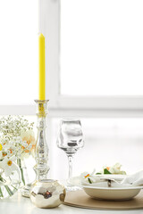 Beautiful table setting with narcissus flowers