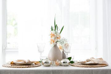 Beautiful table setting with narcissus flowers