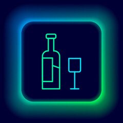 Glowing neon line Wine bottle with glass icon isolated on black background. Colorful outline concept. Vector