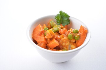 Indian vegetable bean curry in bowl in white background vegan dim sum Halal menu