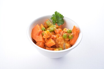 Indian vegetable bean curry in bowl in white background vegan dim sum Halal menu