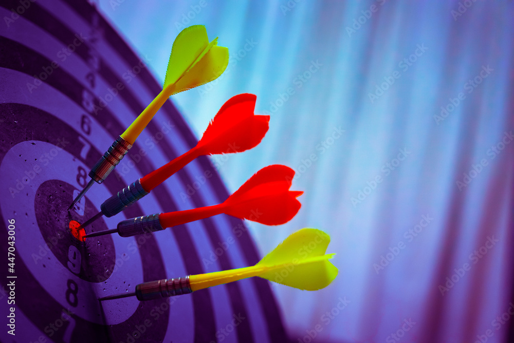 Aufkleber close up shot of the dart arrow hit on bulleyes of dartboard to represent that the business reached 