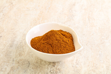 Dry Paprika powder in the bowl