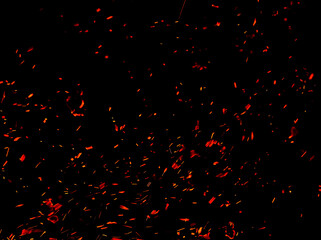 Sparks from fire on a black