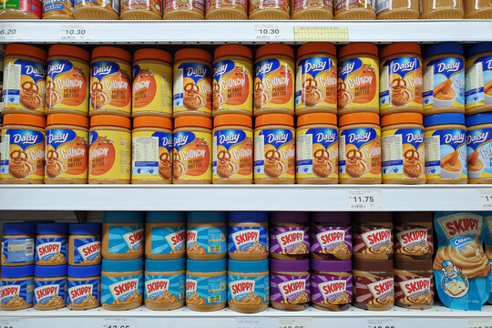 Various choices of spreads peanut butter spread on display shelf in Giant hypermarket. Giant is a trusted supermarket brand in Malaysia. PENANG, MALAYSIA - 21 JULY 2021.