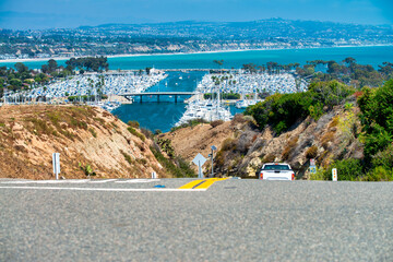 Road with view on Dana Point port, California. - obrazy, fototapety, plakaty