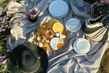 Tasty food for romantic picnic in lavender field