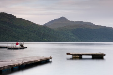 Old derelict wooden jetty pier at Loch Lomond