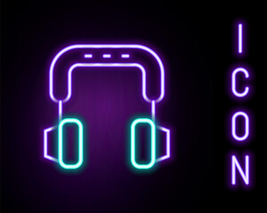 Glowing neon line Headphones icon isolated on black background. Earphones. Concept for listening to music, service, communication and operator. Colorful outline concept. Vector