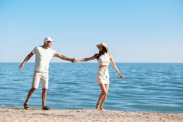 Happy young couple on sea beach