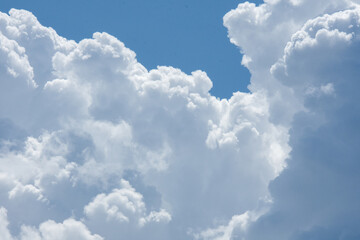 Fototapeta na wymiar clouds in the blue july sky in Canada in the province of Quebec, Canada