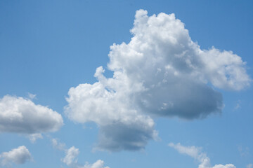 Naklejka na ściany i meble clouds in the blue july sky in Canada