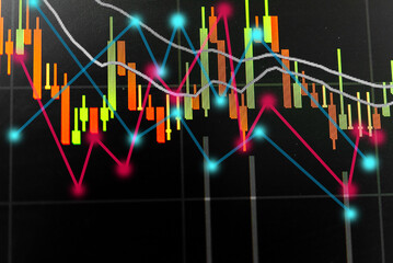 Abstract financial trading graphs and digital number of foreign exchange market trading on monitor. Background of gold and blue digital chart to represent stock market trend.