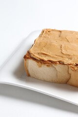 thick peanut butter toast in white background snack halal menu