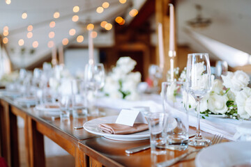 Wedding. Banquet. Luxury rich table setting for a wedding celebration, party in nice cozy restaurant. 