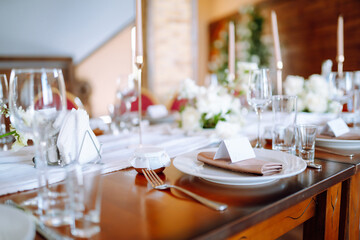 Wedding. Banquet. Luxury rich table setting for a wedding celebration, party in nice cozy restaurant. 