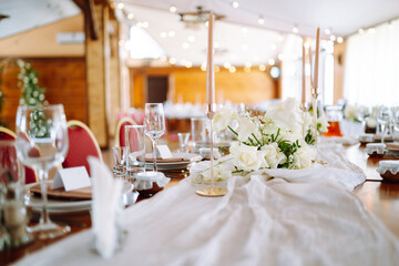 Wedding. Banquet. Luxury rich table setting for a wedding celebration, party in nice cozy restaurant. 