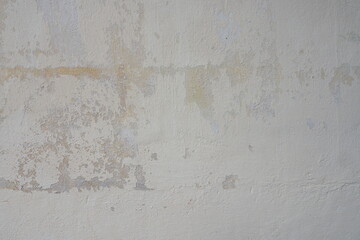 Stains on the old and white cement wall for background and decoration