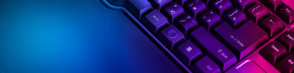 Keyboard professional video gamers with computer. Cyber sport championship, neon blue color lights - obrazy, fototapety, plakaty