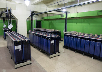 Rows of industrial storage batteries.A room used for backup or uninterruptible power supply.