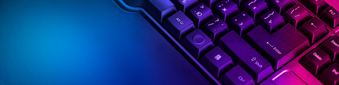 Keyboard professional video gamers with computer. Cyber sport championship, neon blue color lights