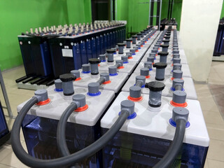 Rows of industrial storage batteries.A room used for backup or uninterruptible power supply.
