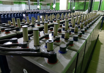Rows of industrial storage batteries.A room used for backup or uninterruptible power supply.