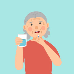 Senior woman taking medicine for illness treatment. Old woman take vitamin or supplement capsule pill with water.