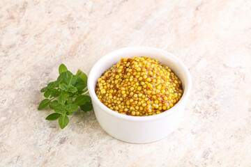 Grain mustard sauce in the bowl