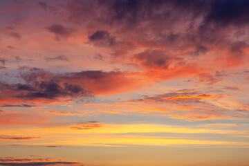 Naklejka na ściany i meble Multicolor clouds on the evening sky . Fantastic heaven scenery 