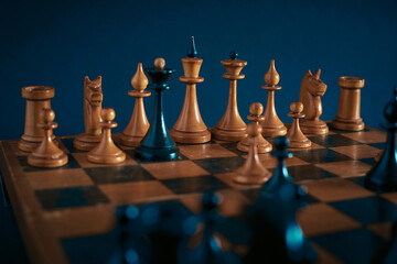 playing wooden chess pieces. Losing a game of chess.