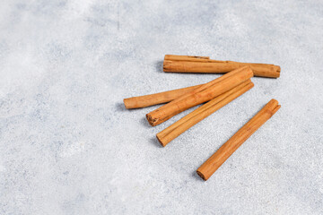 Ceylon cinnamon sticks in a light background.