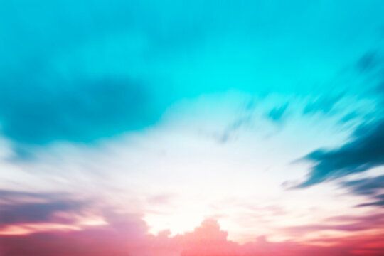 Blur pastels gradient sunset background on soft nature sunrise peaceful morning beach outdoor. heavenly mind view at a resort deck touching sunshine, sky summer clouds.