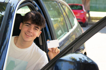 young driver in licensed car